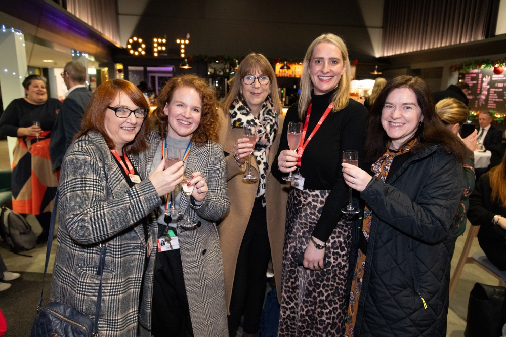 staff at a reception in the QFT foyer ahead of the screening of 'Delivering the Impossible: Agreement Twenty Five' documentary, 5 December 2023.