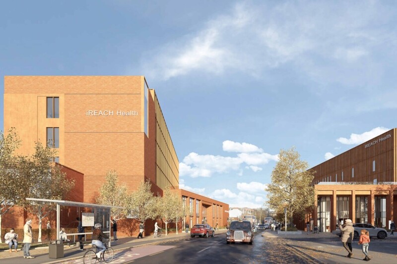 iReach building beside road and pedestrians