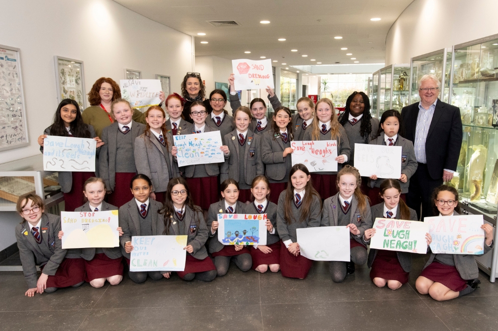 Participants standing and posing at a Workshop as part of the Reach'25 launch