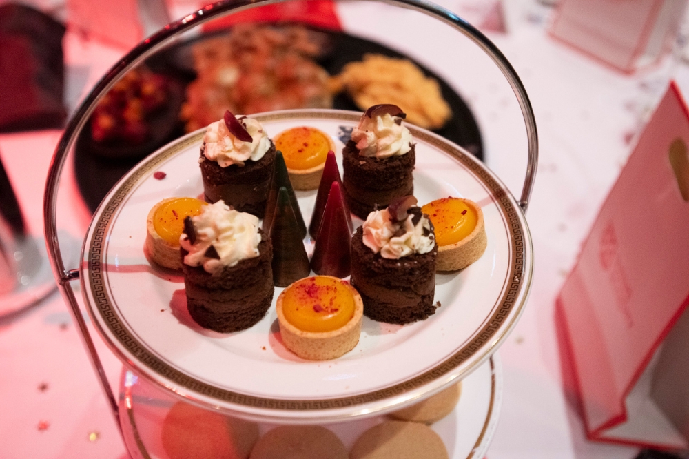 afternoon-tea-style mini desserts on a dinner table at an event