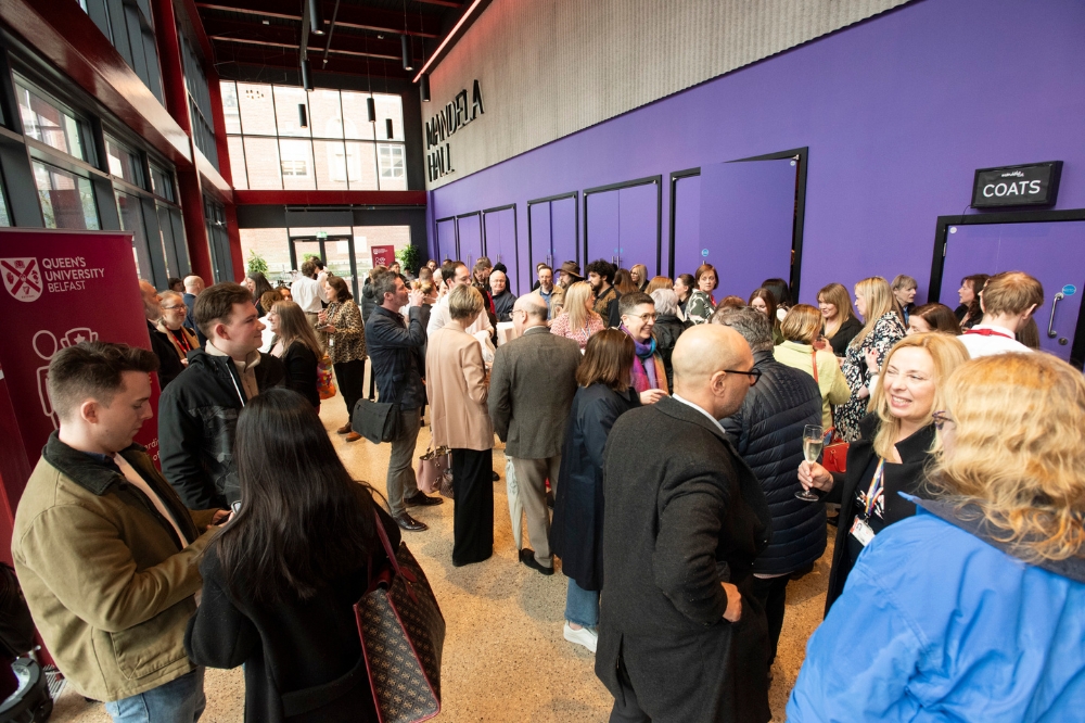 large group of people gathering outside Mandela Hall for an event, Queen's University Belfast