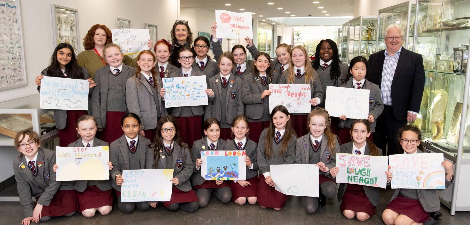 Victoria College Preparatory School pupils with Dr Lorraine Scott from the School of Biological Sciences at Queen's, Ingrid Hess, Artist and Associate Professor of Graphic Design at the University of Massachusetts Lowell, and Professor Michael Alcorn, Associate Pro-Vice-Chancellor (Sustainability and Strategic Projects) at Queen's.